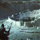 A Destiny 2 Hunter and Warlock overlook an alien ruin shaped like a massive hole.